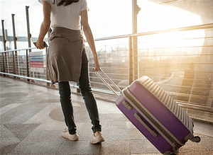 Image of woman with a suitcase.